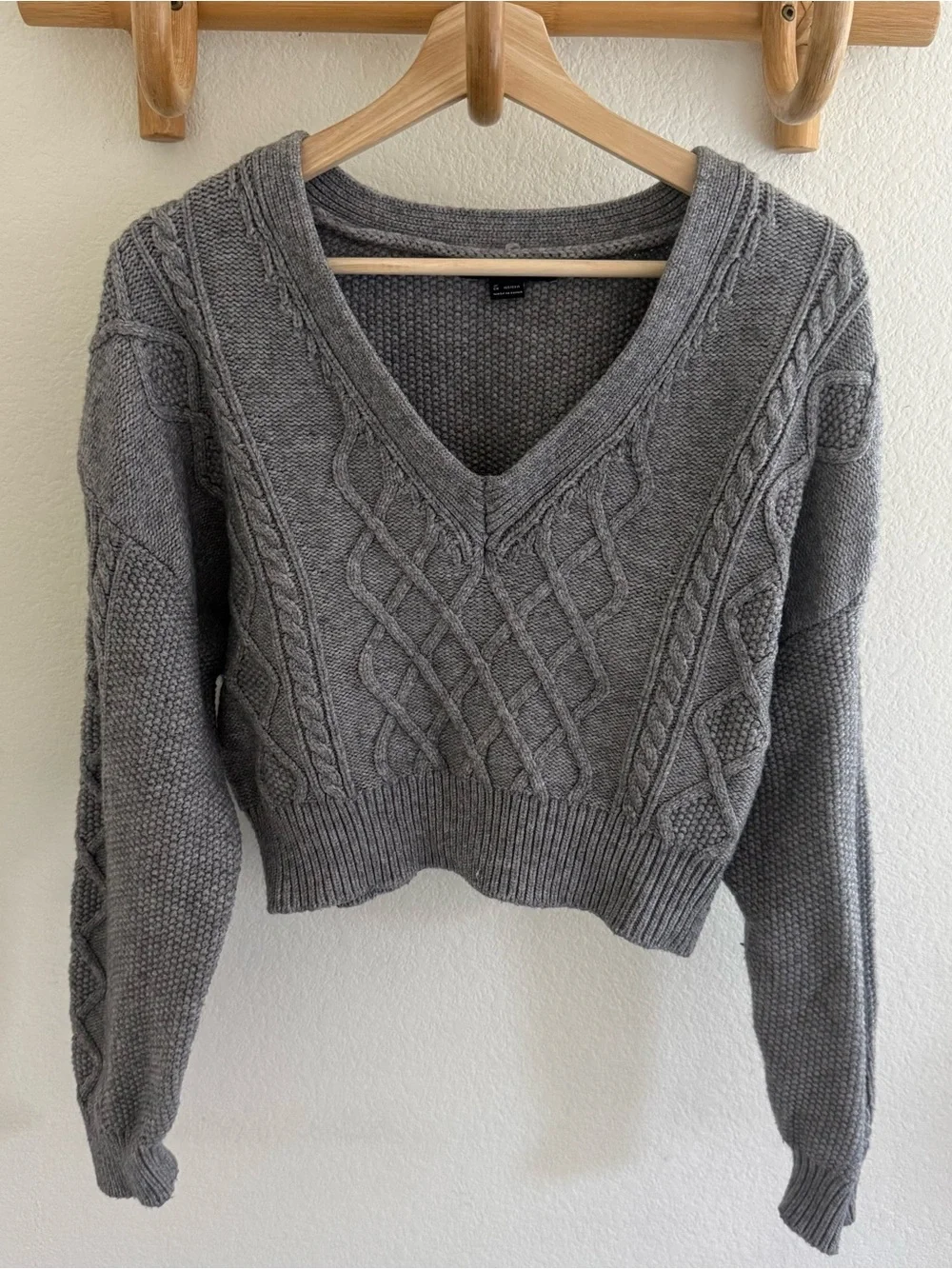 Preppy capsule wardrobe dark academia minimalist gray cable knit cropped sweater